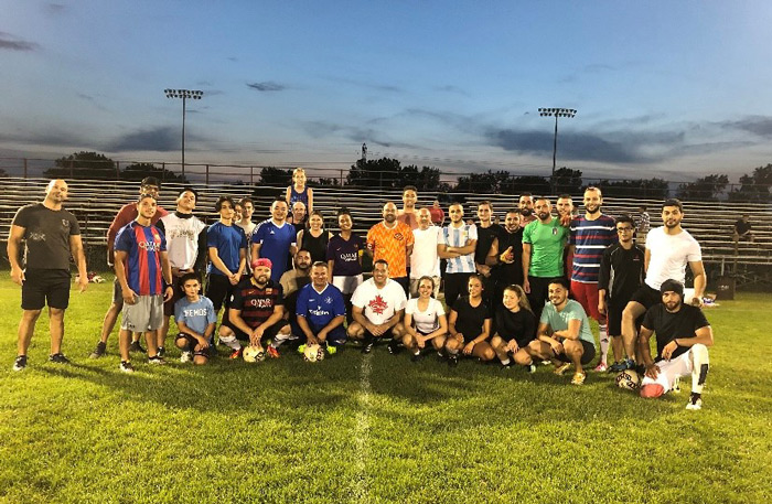 The Capri annual soccer match played under the lights at night.